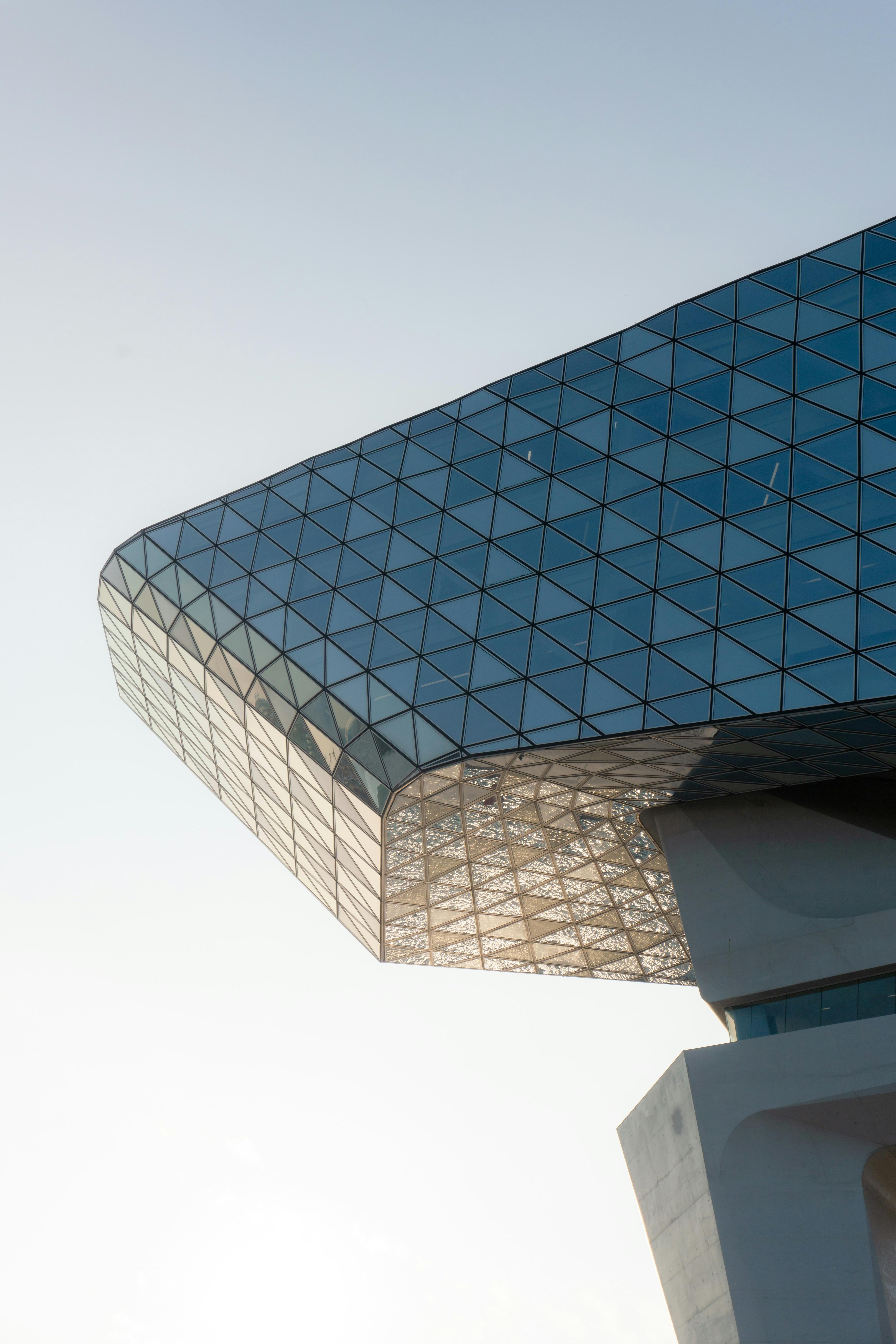 Modern glass building facade. Photo by Nakul Ponkshe on Unsplash